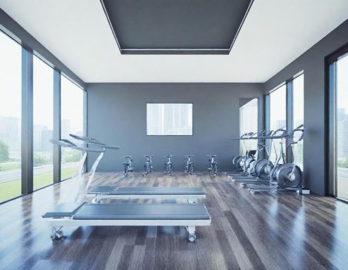Moderne Fitnessstudio-Umgebung mit Laufband und Fahrrädern in hellen, geräumigen Räumen.